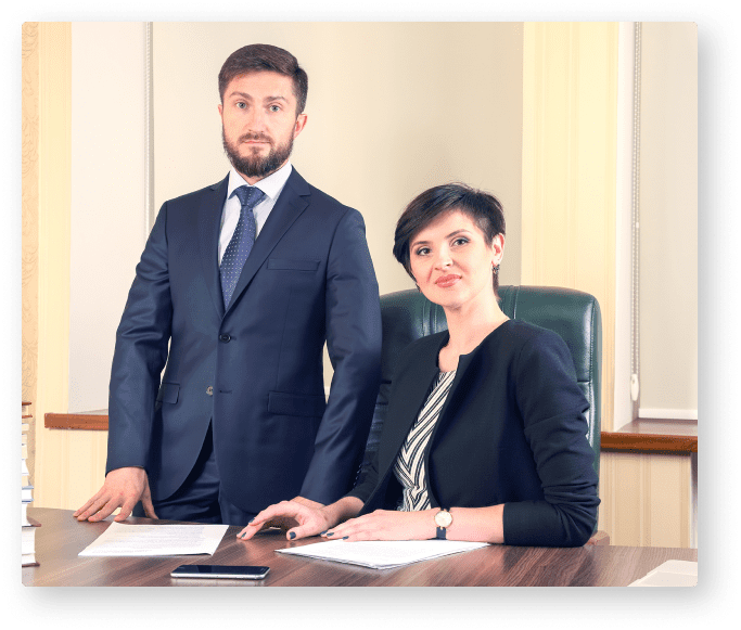 A man and woman are sitting at the table